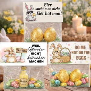 Op de afbeelding: Een set van drie keramische mokken met een gespikkelde, matte afwerking. De mokken zijn in crème, lichtgrijs en donkergrijs. Elke mok heeft een eenvoudig, minimalistisch ontwerp en een afgeronde handgreep.