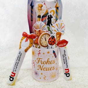 Silvester Orakel Banderole mit Feuerwerksmotiv – festliche Verpackung für Duplo-Riegel als Glücksbringer.