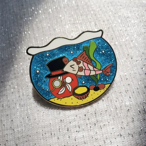 Hong Kongball Fish Tank Enamel Pin featuring a Corydoras Fish and an Egg Tart