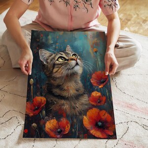 May include: A rectangular canvas print depicting a tabby cat looking upwards, set amongst bright orange poppies against a teal and blue backdrop. The artwork has a painterly style, with visible brushstrokes and soft lighting.