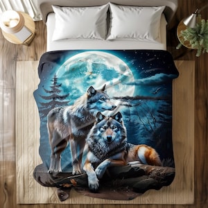 May include: Two grey wolves stand and sit on rocks in a dark forest under a large blue moon. The moon has a white glow and is surrounded by dark blue clouds.