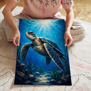 May include: A rectangular art print featuring a geometric, low-poly style sea turtle swimming through deep blue ocean water. The turtle has shades of brown and blue, surrounded by dark rocks and green aquatic plants with light rays above.