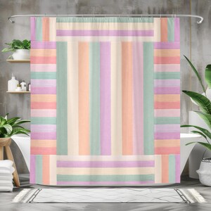 May include: A shower curtain featuring a vertical and horizontal striped pattern in pastel shades of peach, mint green, lavender, and cream. The design consists of a central rectangular panel of vertical stripes framed by a border of horizontal stripes.