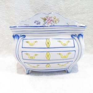 Beautiful and important flower girl in the shape of a chest of drawers faience de Charolles Molin period early 20th c French ceramic chest of drawers