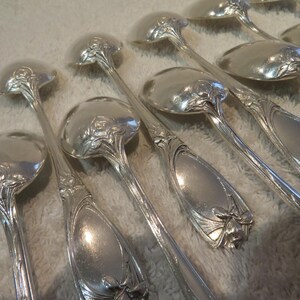 13 silver-plated coffee spoons with orchid decoration Maxim&#39;s Orfèvre Schooman and Orbrille 20th c French silver-plated coffee spoons 15cm