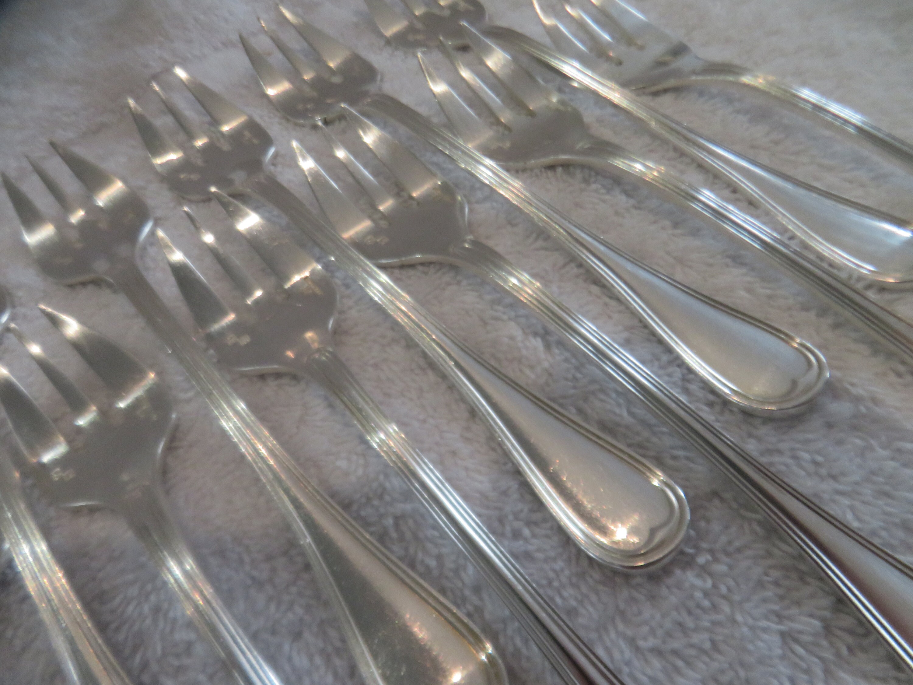 12 fourchettes à huîtres en métal argenté