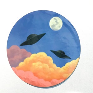 Naklejki winylowe błyszczące UFO nad chmurami