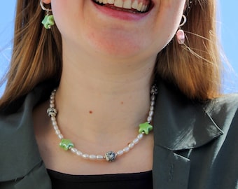 Pearl necklace with ceramic green star beads and round white beads