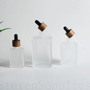 30ml 50ml 100ml Square Glass Essential Oil Perfume Dropper Bottle Empty Black Wooden Caps Clear Dropper Body Serum Packaging Wholesale