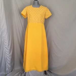 Bright yellow 1970&#39;s hostess gown with white polka dot pattern and flowing sheer skirt, long gold 1970&#39;s short sleeved dress, maxi dress