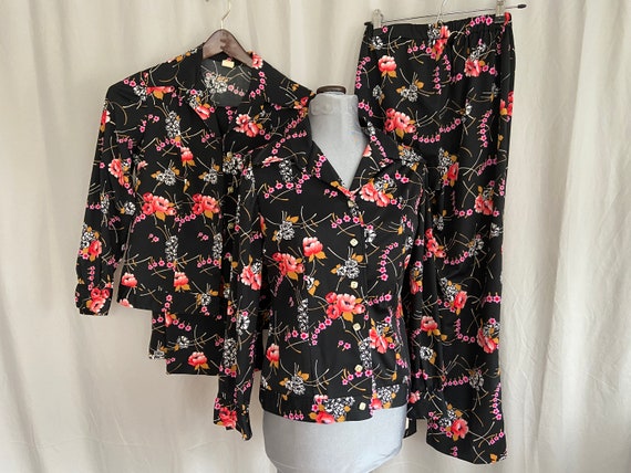 Pair of identical black floral vintage pant suits… - image 1