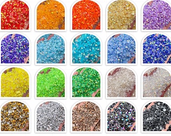 Pode incluir: Conjunto de 1500 strass de tamanhos variados em 25 cores diferentes, incluindo transparente, branco, vermelho, laranja, amarelo, verde, azul, roxo, prata, dourado e preto.