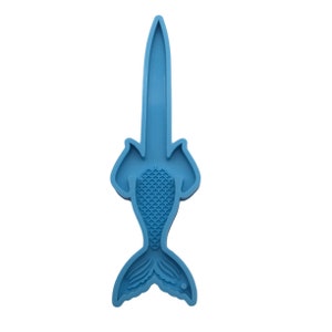 May include: Blue silicone mold shaped like a mermaid tail with a fin and scales. The mold is designed for making resin crafts.