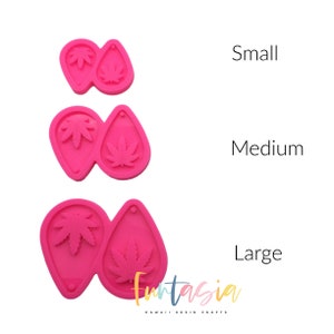 May include: Three pink silicone molds for resin earrings, each with a different size: small, medium, and large. Each mold features a marijuana leaf design.
