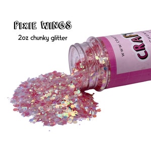 May include: A pink jar of chunky glitter labeled "Pixie Wings" with 2 oz of glitter spilling out of the jar.