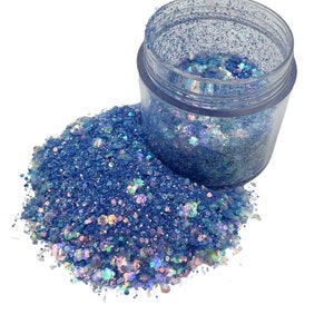 May include: A set of three ceramic mugs with a speckled, matte finish. The mugs are in shades of cream, light gray, and dark gray. Each mug has a simple, minimalist design, perfect for coffee or tea.