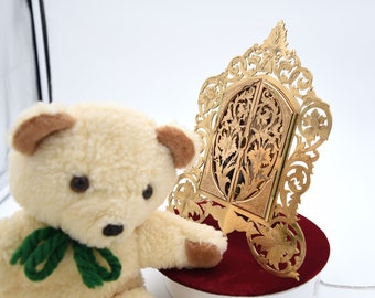 Antique Gilt-Bronze reticulated shaped Photo Frame with pair of arched doors revealing oval glass interior supported by two prong easel.