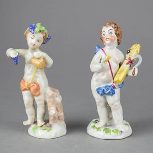 Two antique Italian CAPODIMONTE porcelain cherub figurines &quot;Allegory of Summer and Autumn&quot;
