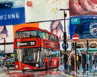 May include: A red double-decker bus with the words "Victoria 38" on the front, driving down a street in London. The bus is surrounded by billboards and people walking on the sidewalk.
