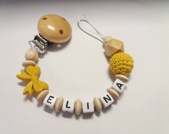 Pacifier necklace with name in mustard yellow with bow and crochet bead, gift for birth