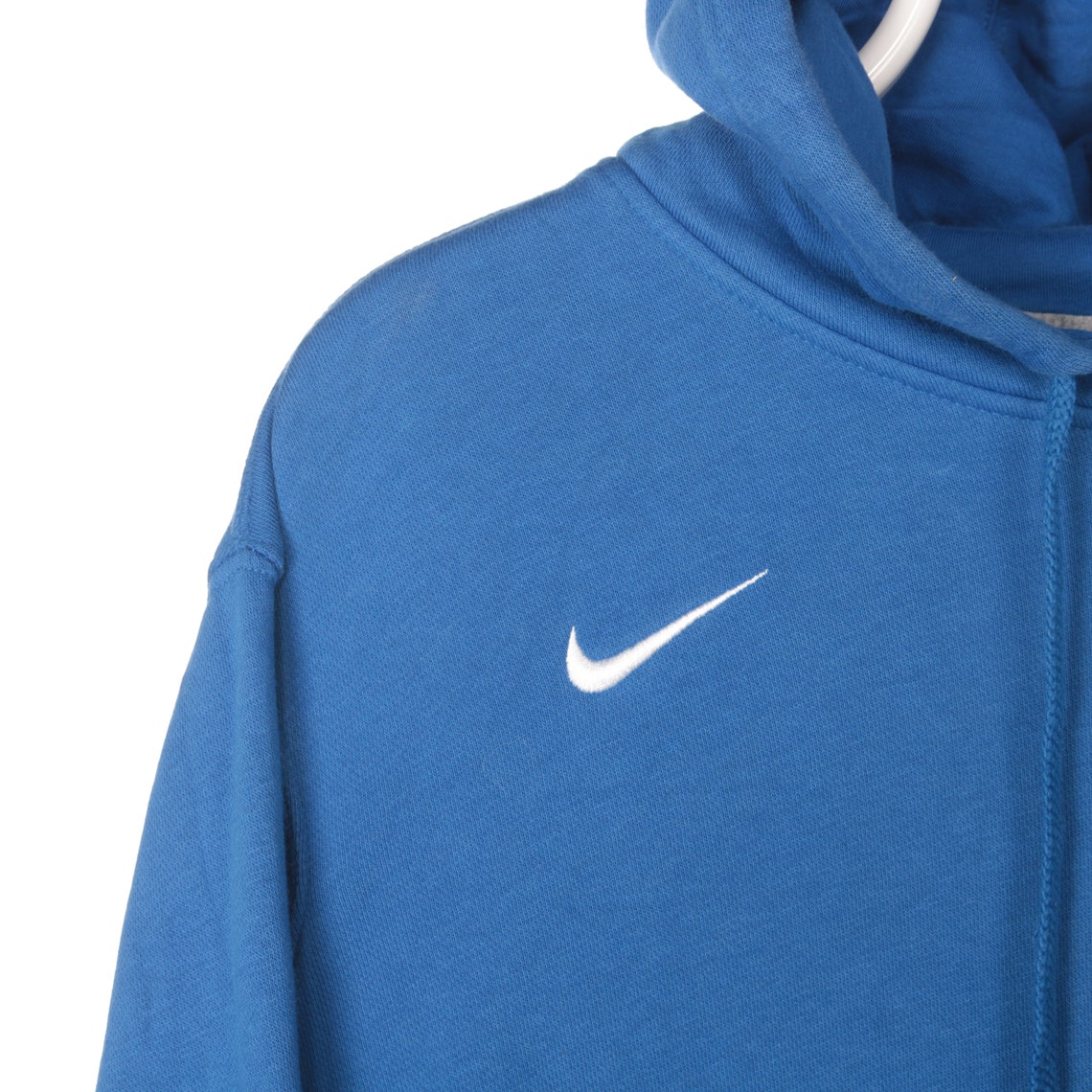 white nike hoodie with blue swoosh