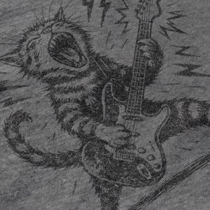 May include: A grayscale illustration of a cat playing an electric guitar. The cat is depicted with an open mouth, as if roaring, and is surrounded by lightning bolt graphics. The guitar is a classic six-string model.