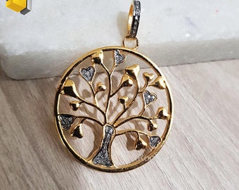 May include: A gold pendant in the shape of a tree of life with small diamonds set in the leaves and trunk. The pendant is round and has a bail at the top.