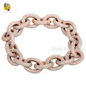May include: A rose gold chain bracelet with a pave diamond design. The bracelet is made of interlocking oval links.