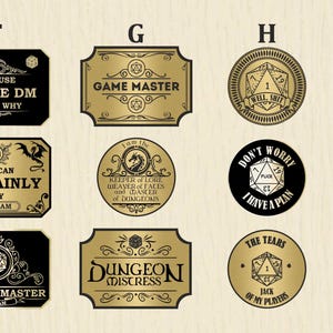 May include: Ten gold and black circular and rectangular stickers with various designs and text. The stickers feature dice, dragons, and text such as "Game Master", "Dungeon Mistress", and "You Can Certainly Try William".