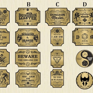 May include: A set of 20 gold-coloured metal labels with black text and images. The labels feature various Dungeons and Dragons themes, including "Dungeon Master", "Barbarian", "Cleric", "The Dice Giveth", and "Keep Calm and Divine Smite".