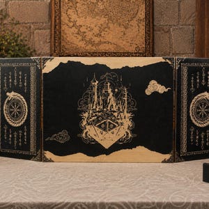 May include: A three-panel folding wooden screen featuring a black and natural wood finish. The center panel displays a detailed etched illustration of a castle and a large twenty-sided die. The side panels feature Ouroboros symbols and runes.