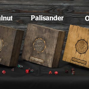 May include: Three wooden boxes labeled Walnut, Palisander, and Oak, each with a metal emblem and the text "DUNGEONS & DRAGONS". Dice are scattered in front of the boxes. The boxes are various shades of brown.