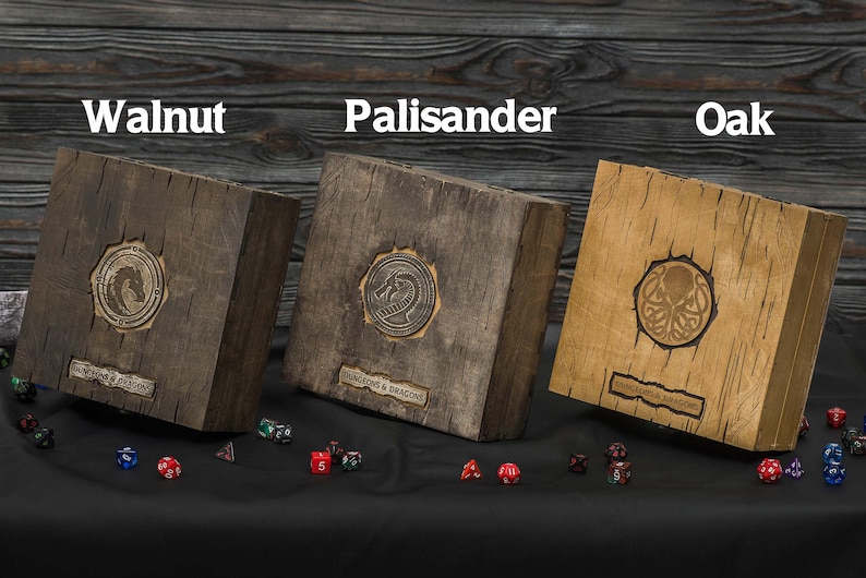 May include: Three wooden boxes labeled Walnut, Palisander, and Oak, each with a metal emblem and the text "DUNGEONS & DRAGONS". Dice are scattered in front of the boxes. The boxes are various shades of brown.