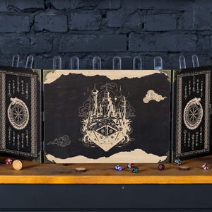 May include: A three-panel wooden game board with a black background and gold accents. The center panel features a detailed illustration of a castle with a dragon and the text "The Dragon's Keep". The side panels feature a repeating pattern of runes and a dragon.
