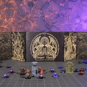 May include: A black folding Dungeon Master screen featuring gold line art of Cthulhu, a lighthouse, and a castle. The screen is displayed on a grid mat with various miniature figures, stone terrain pieces, and multi-sided gaming dice scattered around.