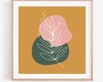 May include: Abstract art print featuring a white leaf design over a pink and dark green shape on a mustard yellow background. The artwork is framed in a light wood frame, suitable for home decor.