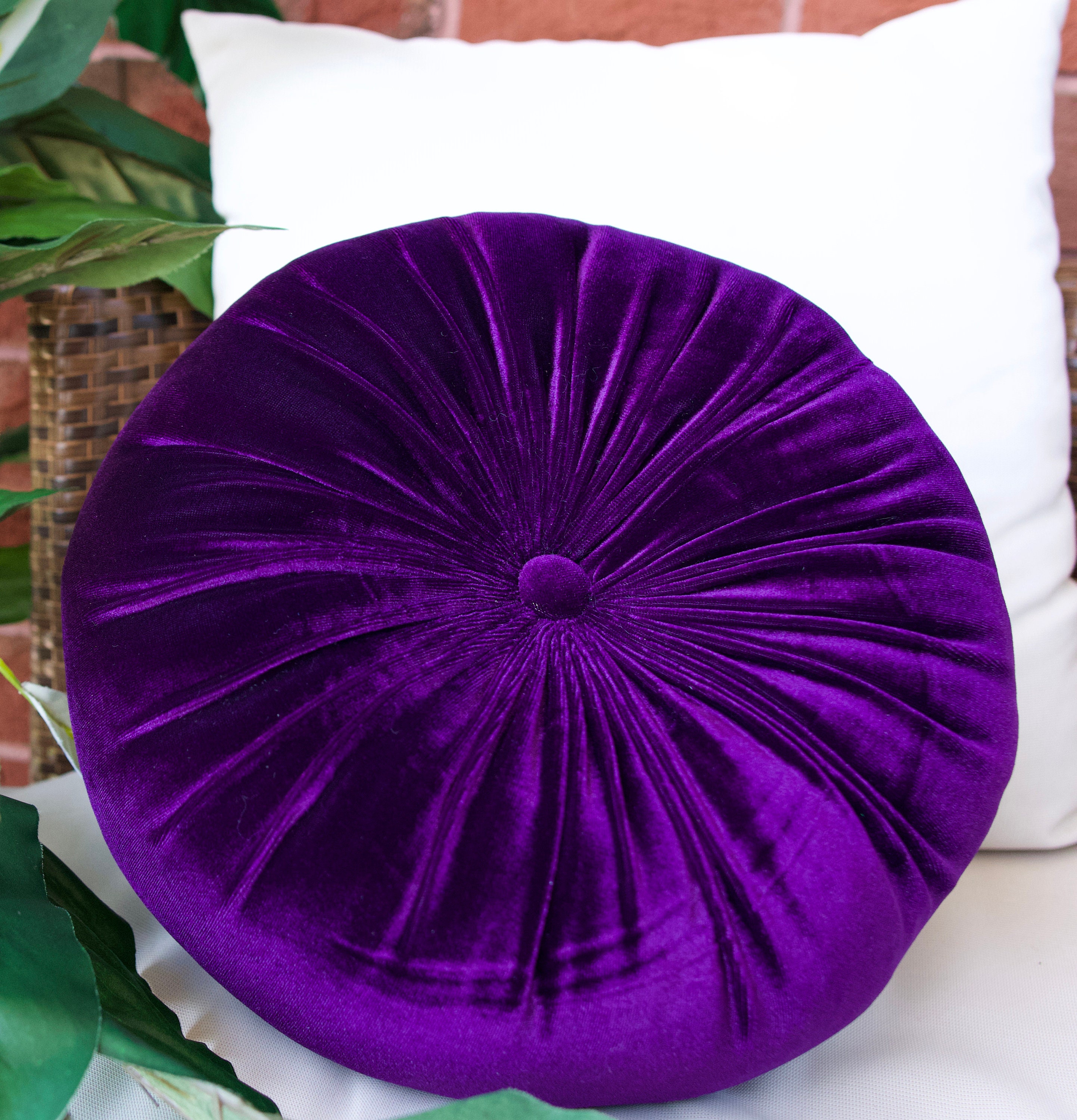 round purple velvet pillow