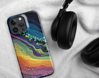 May include: A smartphone case with a colorful abstract design. The case features a vibrant mix of colors, including blue, green, yellow, orange, and purple, creating a flowing, artistic pattern. Black headphones are placed next to the phone case on a white surface.