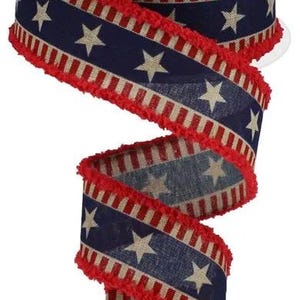 May include: Red, white, and blue patterned ribbon with a frayed edge. The ribbon features a distressed look with stars and stripes.