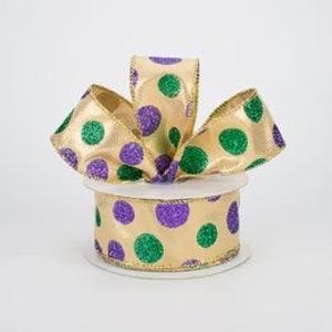 May include: Gold ribbon with green and purple polka dots. The ribbon is 2.5 inches wide and has a metallic sheen.