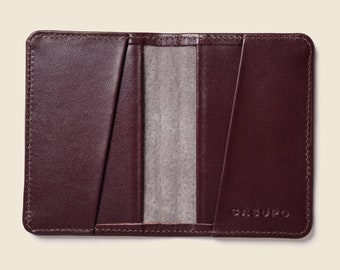 Burgundy thin leather wallet with RFID blocking for men. Maroon, bright neon green women's small, compact leather bifold. Concert and games.