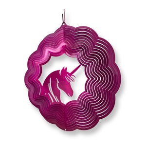 May include: A pink metal wind spinner with a unicorn silhouette in the center. The spinner has multiple layers of metal that create a swirling effect when it spins.