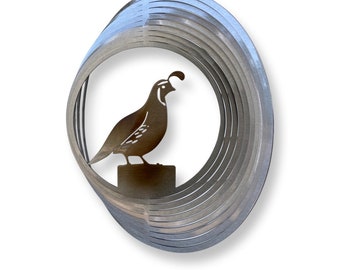 May include: A silver metal wind spinner with a cut-out design of a quail standing on a perch. The wind spinner has multiple layers of metal that spin in the wind.