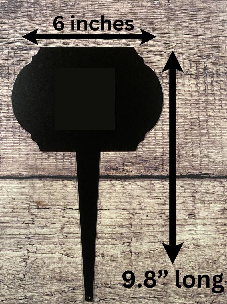 May include: Black metal garden stake with a 15.2 cm square opening and a 25 cm long stake.