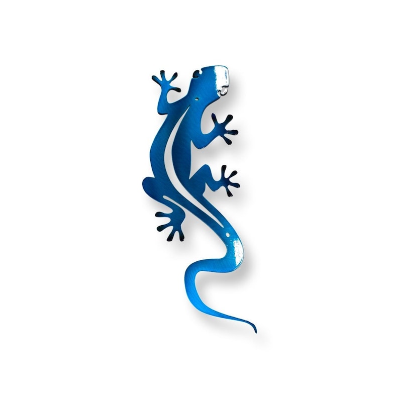 May include: A blue metal gecko wall decor with a stylized design. The gecko is facing right and has a long tail.