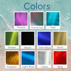 May include: A chart showing different colours of thread, including purple, teal, green, black, dark blue, gold, copper, light blue, clear, and red.