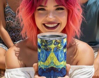 May include: A cylindrical tumbler featuring a vibrant print of Van Gogh's "Starry Night" painting. The tumbler is held by a person on a sandy beach, with two other people in the background. Palm trees and a blue sky are visible.