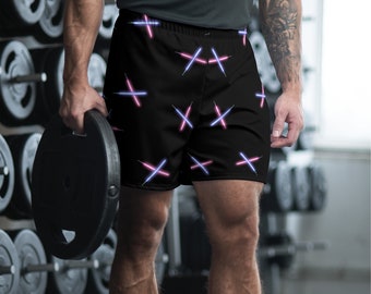 Puede incluir: Pantalones cortos deportivos negros con un patrón repetido de sables de luz cruzados de color rosa y azul.
