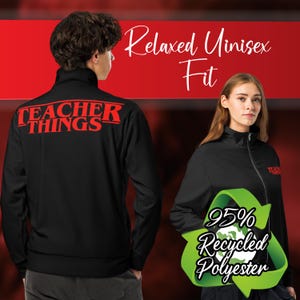 May include: Black zip-up jacket with the text "Teacher Things" in red on the back. The jacket is made from 95% recycled polyester and has a relaxed unisex fit.