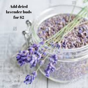 May include: A glass jar filled with dried lavender buds. The jar is on a white surface with a sprig of lavender flowers next to it. The text "Add dried lavender buds for £2" is visible in the image.